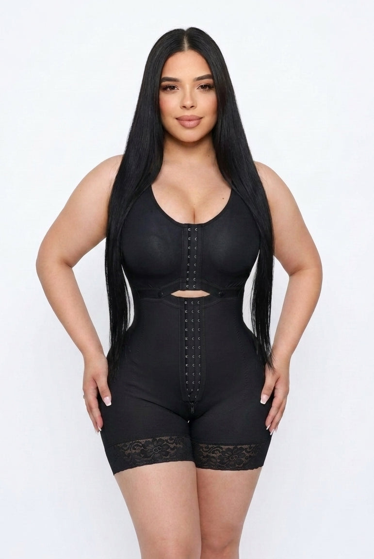 Woman wearing a black shapewear garment on a white background