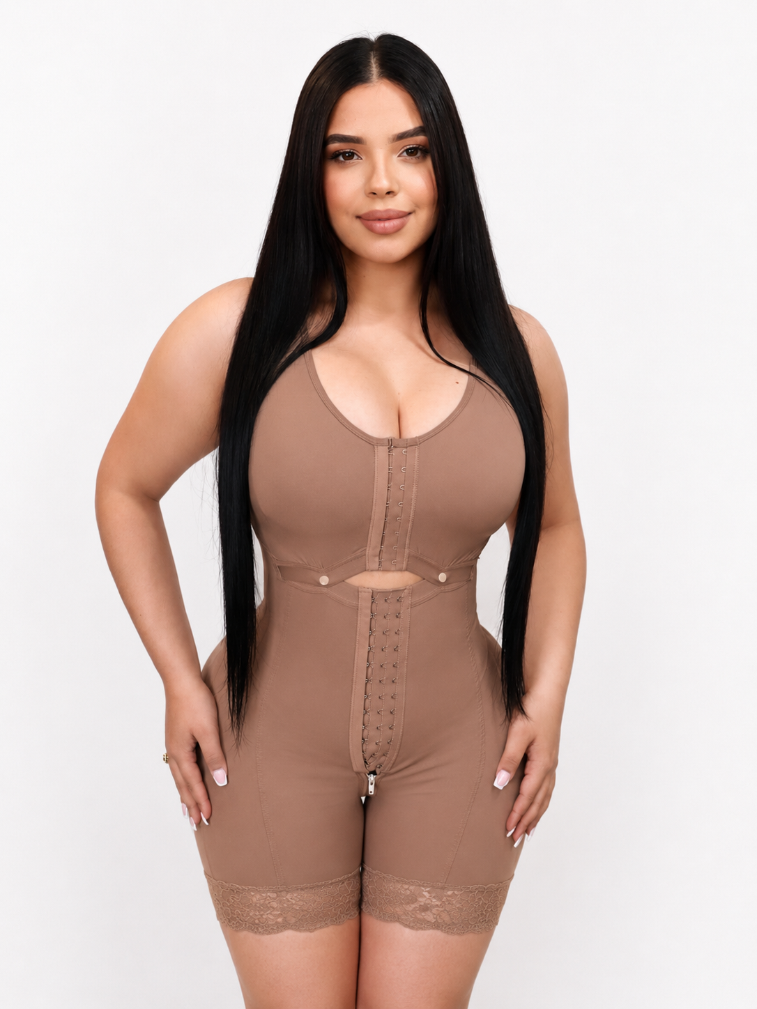Woman wearing a brown shapewear jumpsuit on a white background